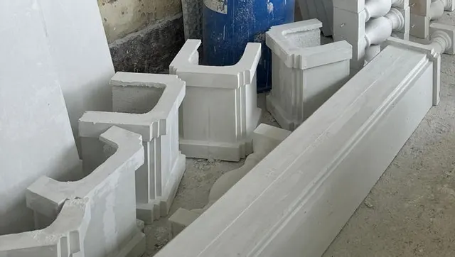 Hollow GRC pedestal shells and a long coping piece on the factory floor